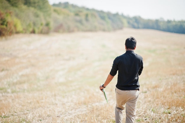 South asian agronomist farmer inspecting wheat field farm Agriculture production concept