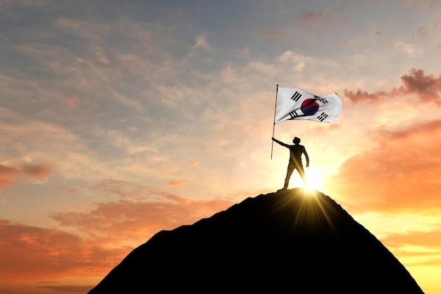 사진 산 정상 d 렌더링의 꼭대기에서 흔들리는 한국 국기