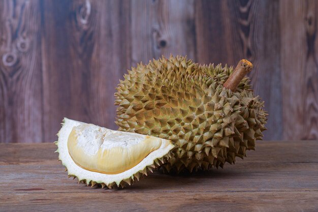 Southeast Asia's King of the Fruits Durian on wooden background Ripe durian Tasty durian that has been peeled