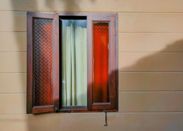 Southeast Asian rustic style wooden windows in the sunlight