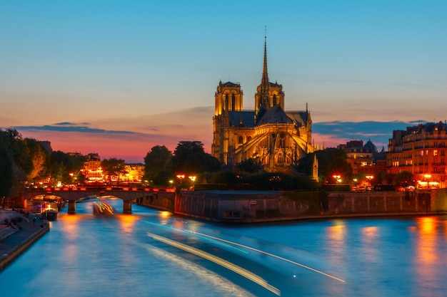 The southern facade of cathedral of notre dame de paris at sunset