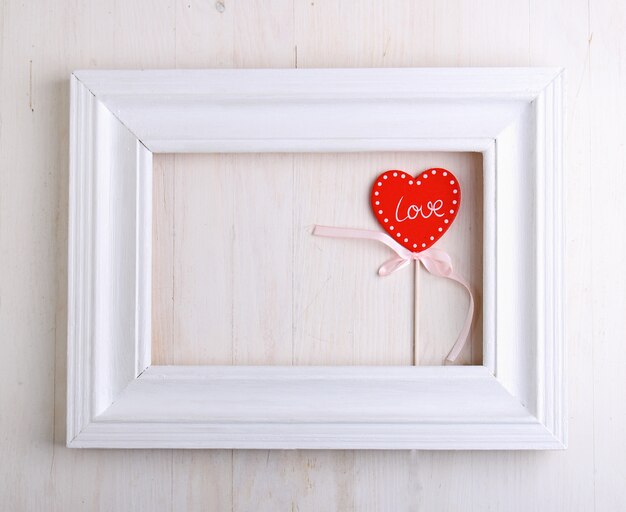 Souvenir gift for Valentine's Day red heart with a white ribbon