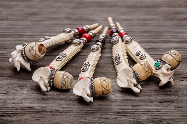 Souvenir smoking pipe, handmade. Smoking ritual. Copy space, studio shot.