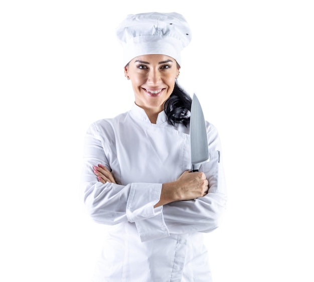 Sovereign view of a young female chef with crossed arms holding a kitchen knife Isolated white background