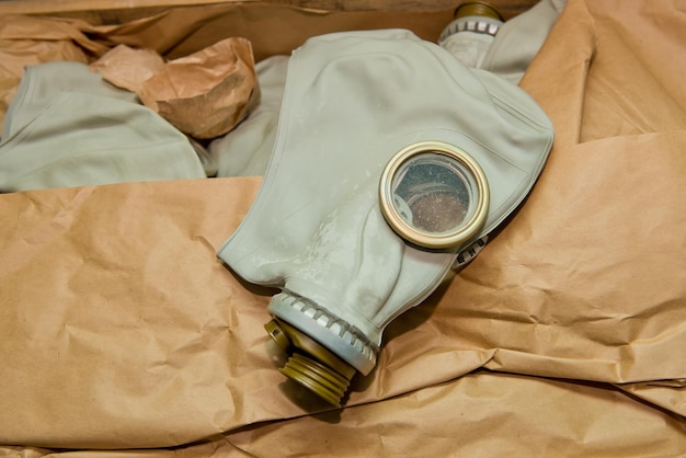 Soviet gas mask in a wooden box Warehouse of Soviet protective equipment Closeup