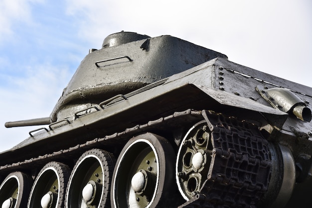 Soviet russian military old tank on blue sky background