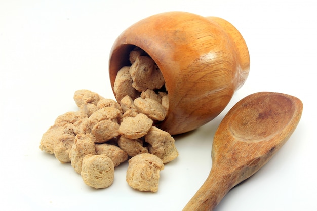 Soy meat in chunks on white background. Top view of raw soybeans chunks