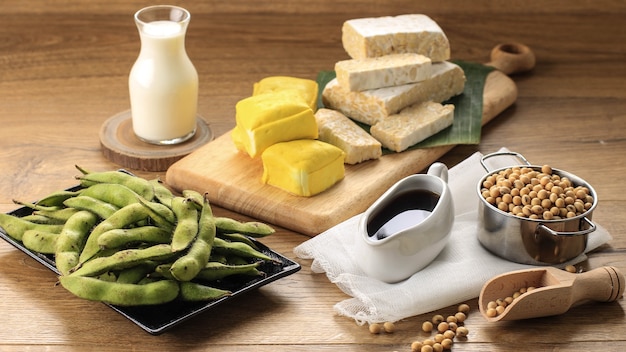 Photo soy product: raw tofu, tempeh, soy milk, soy sauce, and soy bean. concept of healthy vegetarian food