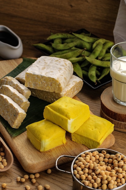 Photo soy product: raw tofu, tempeh, soy milk, soy sauce, and soy bean. concept of healthy vegetarian food