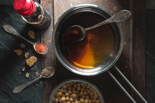 Soy sauce in a saucepan chickpeas and spices closeup