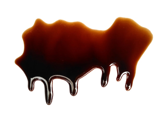 Soy sauce on white background Spilled soy sauce sauce puddle Texture of spilled soy sauce