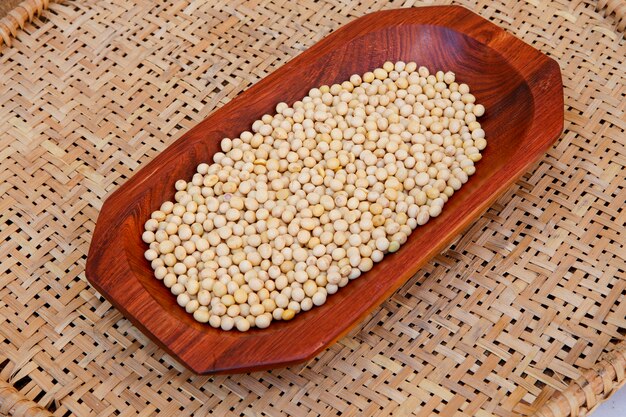 Soya beans closeup on wooden platter