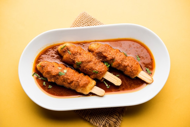 Soya chaap curry served in a bowl. healthy recipe popular in india and pakistan