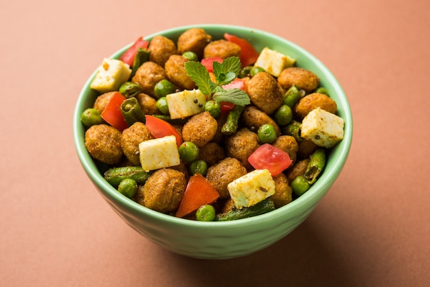 Soya Chunks Masala Fry OR Meal Maker Fry using paneer or Cottage cheese cubes and vegetables. Popular healthy snack recipe from India. Served in a bowl. Selective focus