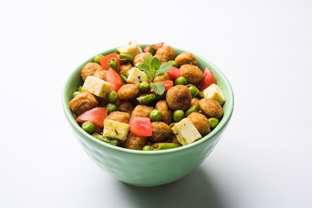 Soya Chunks Masala Fry OR Meal Maker Fry using paneer or Cottage cheese cubes and vegetables. Popular healthy snack recipe from India. Served in a bowl. Selective focus