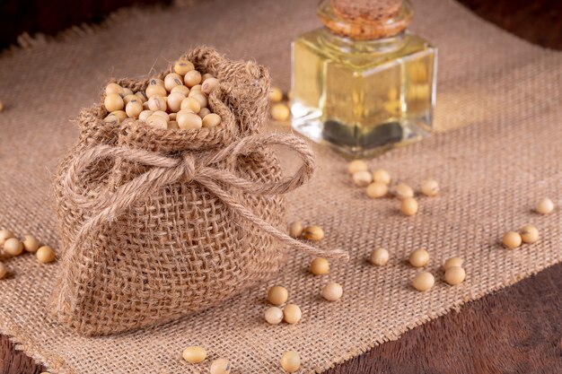 Soybean oil on a wooden background. rustic style