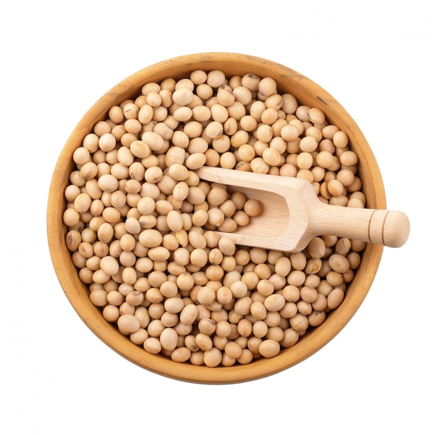 Soybean in a wooden bowl isolated on white background