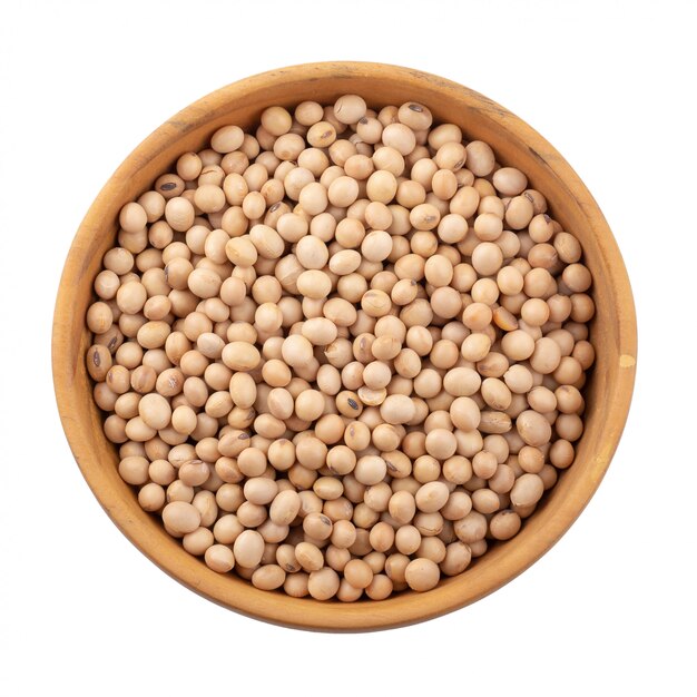 Soybean in a wooden bowl isolated on white background