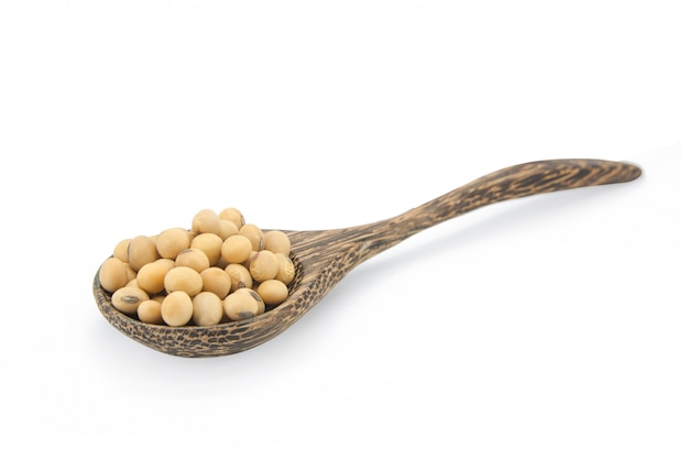 Photo soybean on wooden spoon isolated on white with clipping path.