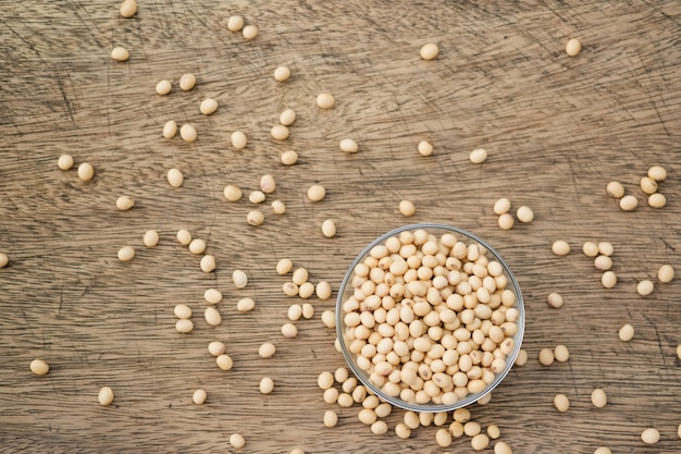 Soybeans are in a cup, placed on a wooden table