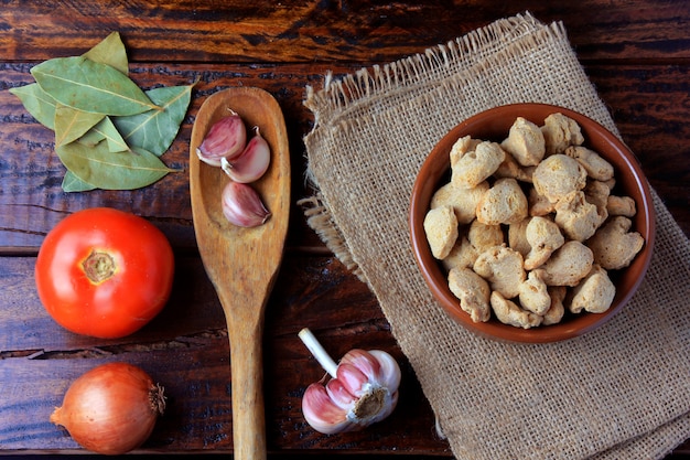 Soybeans meat, chunks in a brown ceramic bowl. 