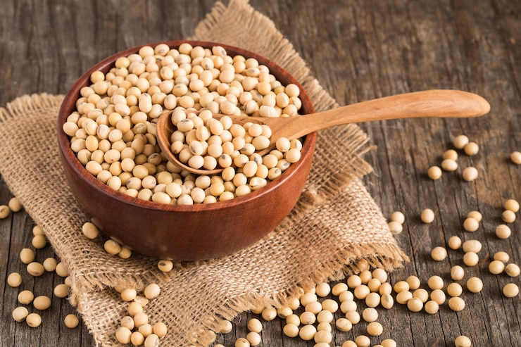 Photo soybeans on old wood background,top view