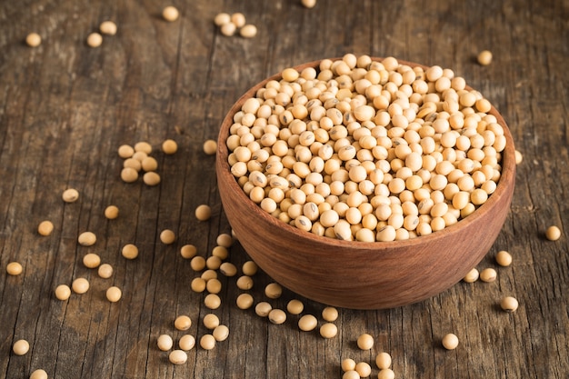 Soybeans in a wooden bowl On the old wood table