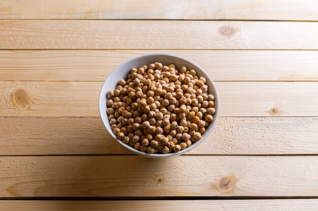 Soybeans over wooden table 