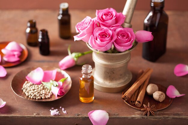 Photo spa and aromatherapy set with rose flowers mortar and spices