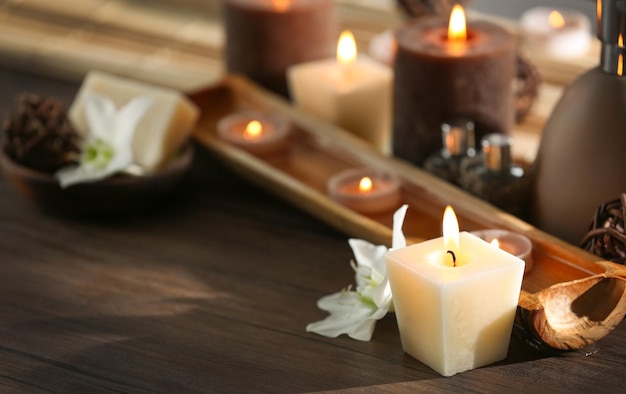 Spa composition with candles on blurred background