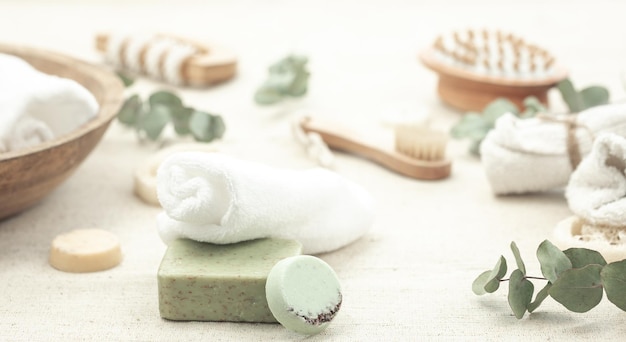 Spa composition with soap brushes and towels on a blurred background