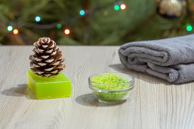 Spa composition with towel sea salt soap and pine cone