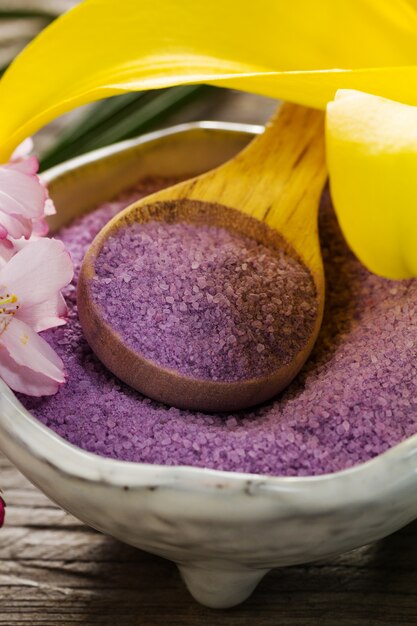 Spa Concept. Closeup of beautiful Spa Products - Spa Salt and Flowers. Horizontal.