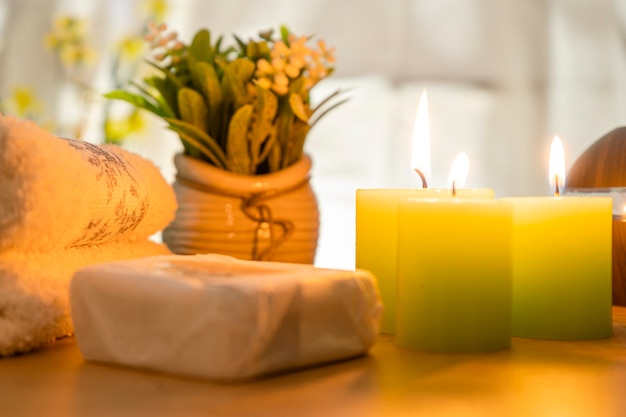 Spa concept Towels candles and handmade soap for facial cleansing treatment massages and relax