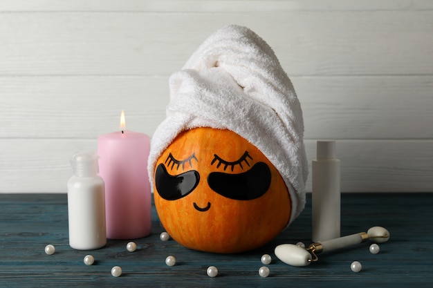 Photo spa concept with pumpkin on wooden background