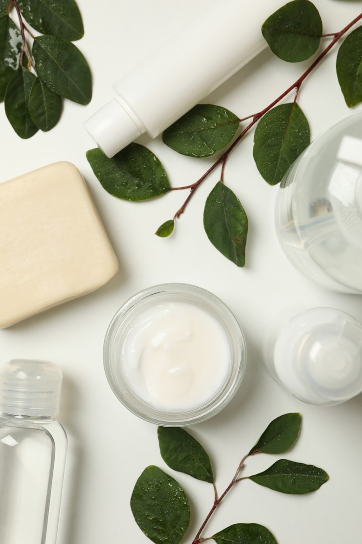 Photo spa cosmetic products and branches with leaves