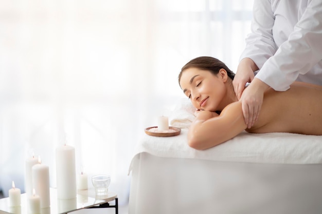 Spa Day Beautiful Indian Woman Enjoying Relaxing Massage In Salon