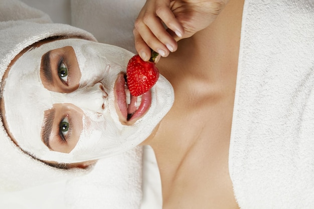 Spa face peeling mask skin care beautiful woman with a clay\
mask o