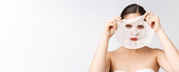 Spa healthcare Woman with purifying mask on her face isolated on white background