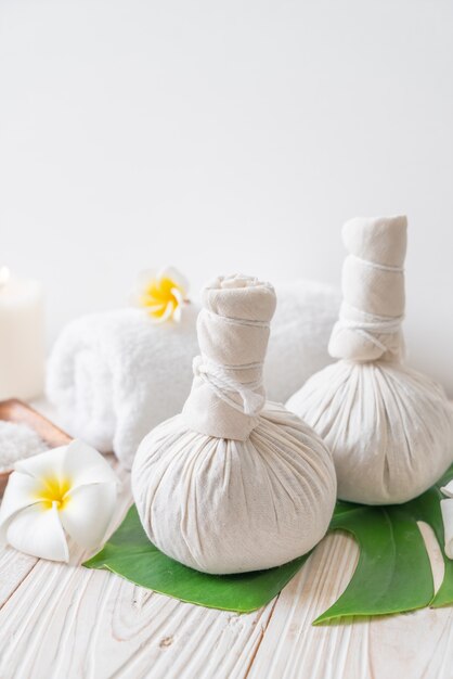 Spa herbal compressing ball with candle and orchid