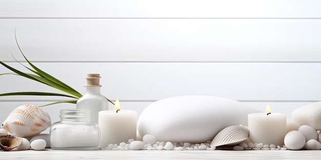 Spa items like massage stones oils and sea salt on a white wooden table empty area