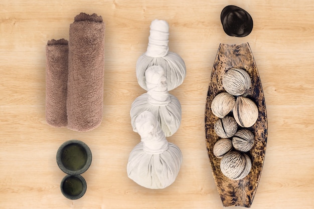 Spa and massage accessories on wooden background