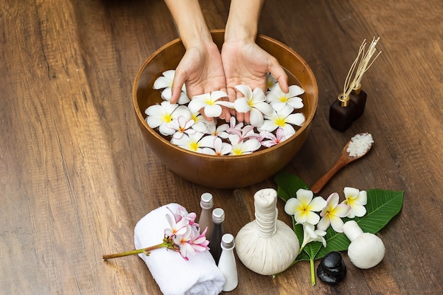 Spa massage compress balls, herbal ball on the wooden with treaments spa