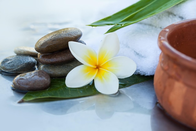 Spa objects and stones for massage on white background