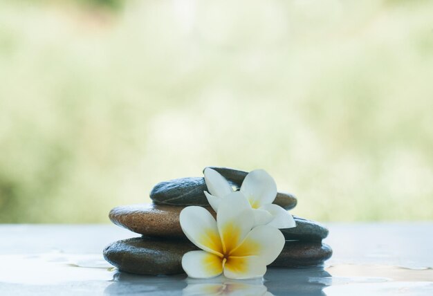 Spa objects on white marble table outdoors