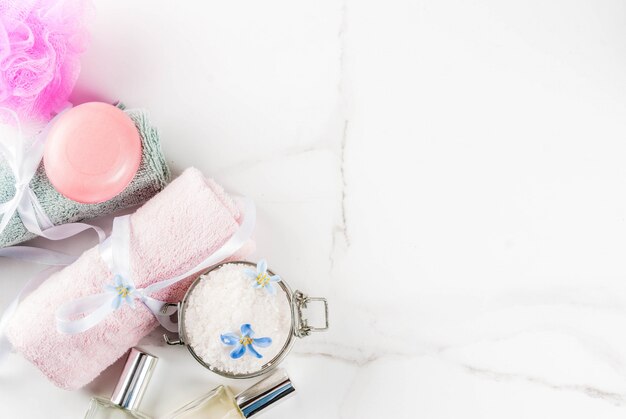 Spa relax and bath concept, sea salt, soap, with cosmetics and towels in bathroom