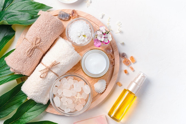 Spa salon with women's cosmetics on a white background top view