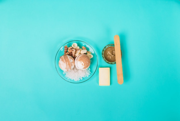 Spa sea salt shells on blue background