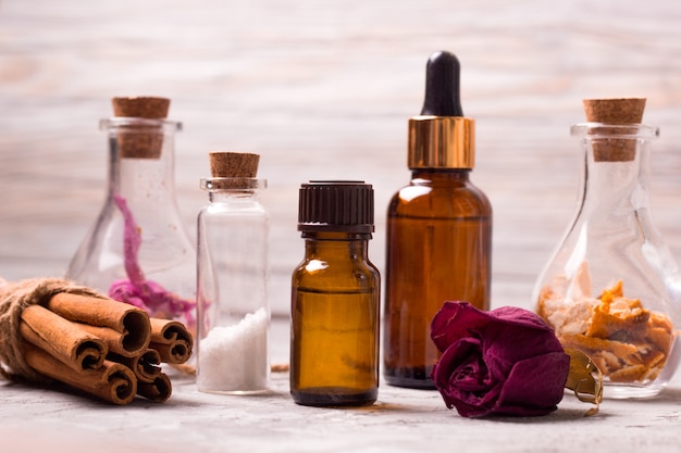 Spa set bottles: dry rose petals, orange peel, aroma oils, sea salt, cinnamon