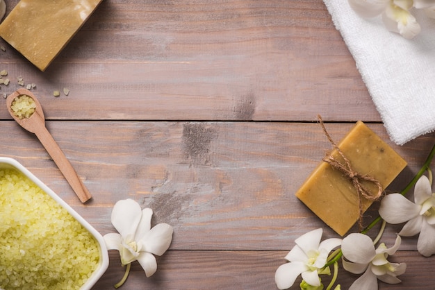 Spa set. handmade, natural organic soap and white orchid on a wooden background